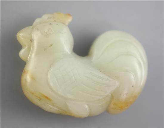 A Chinese pale Celadon and russet jade cockerel figure, 4.3cm